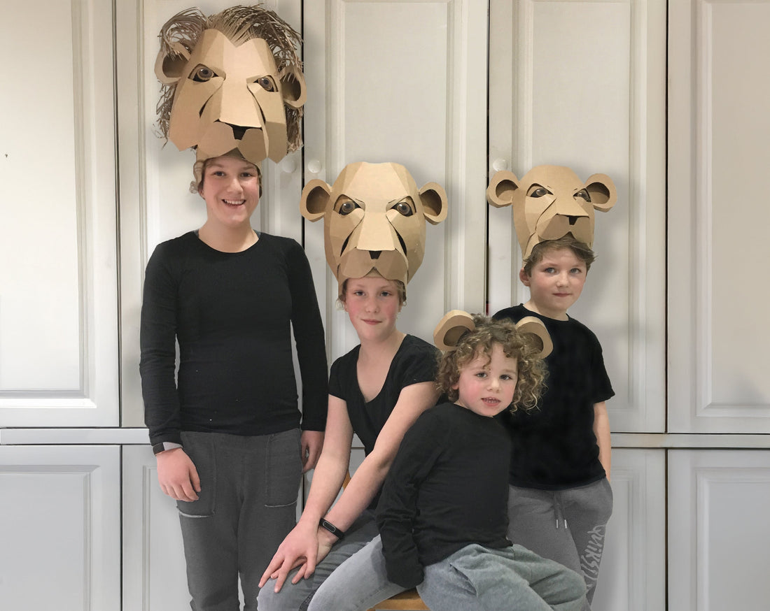 DIY Cardboard lion Headdress, children pictured wearing a pride of lion costumes for a Lion King performance