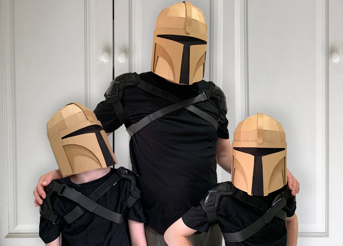 Family of Bounty Hunters wearing DIY cardboard helmets 