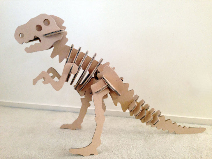 A giant DIY dinosaur puzzle made from cardboard and mdf.