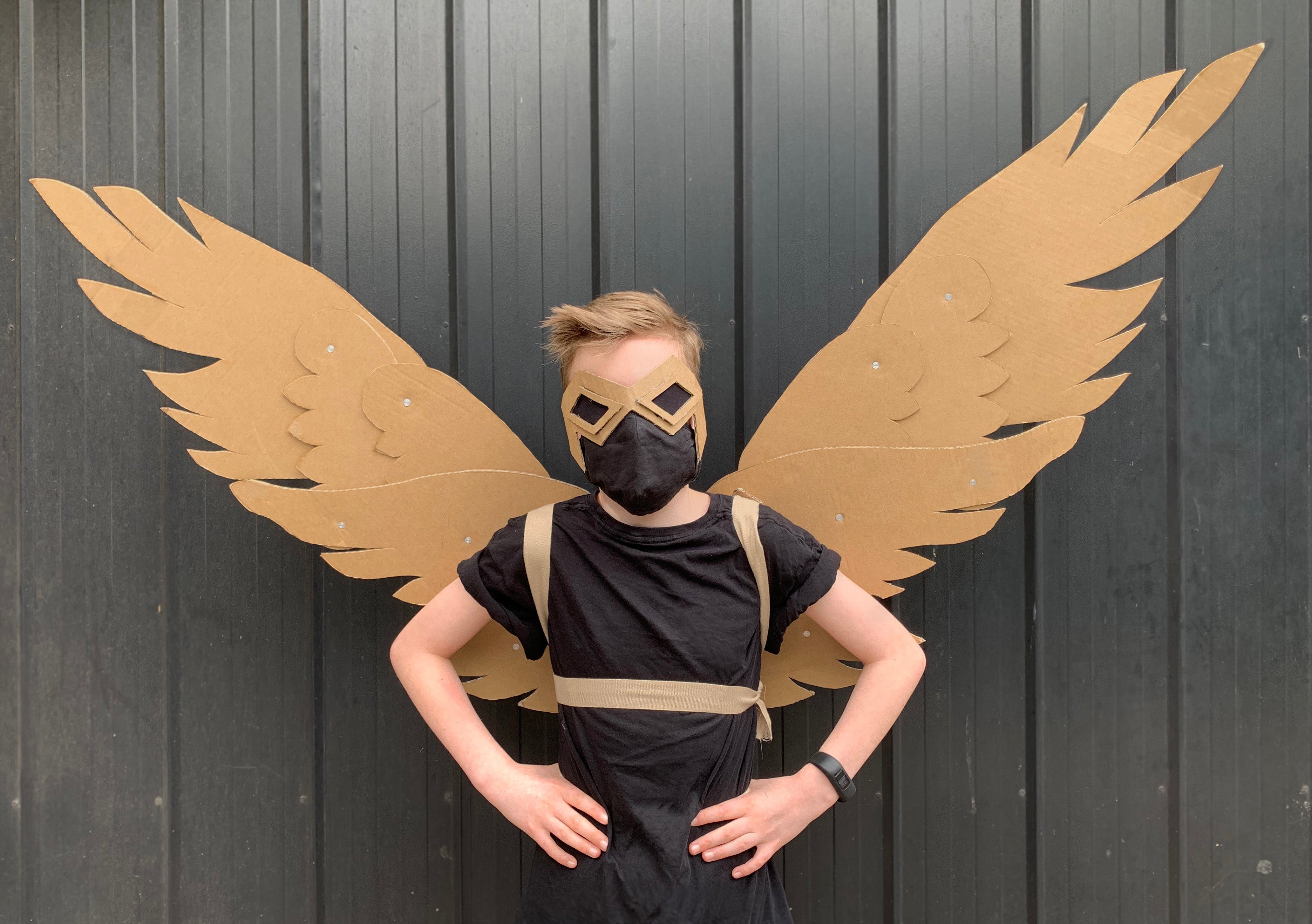 DIY Cardboard articulating wings costume, child is dressed up to look like The Falcon.