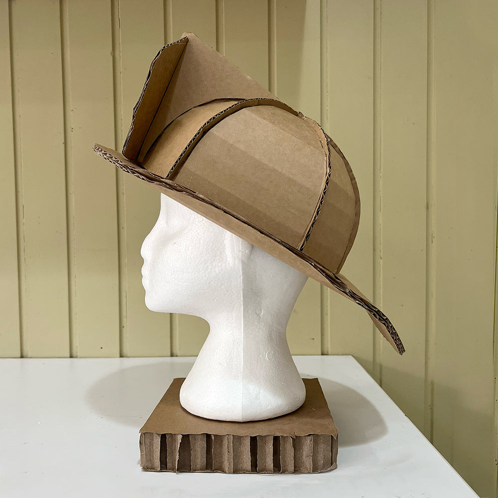 Side view of a DIY cardboard fireman helmet