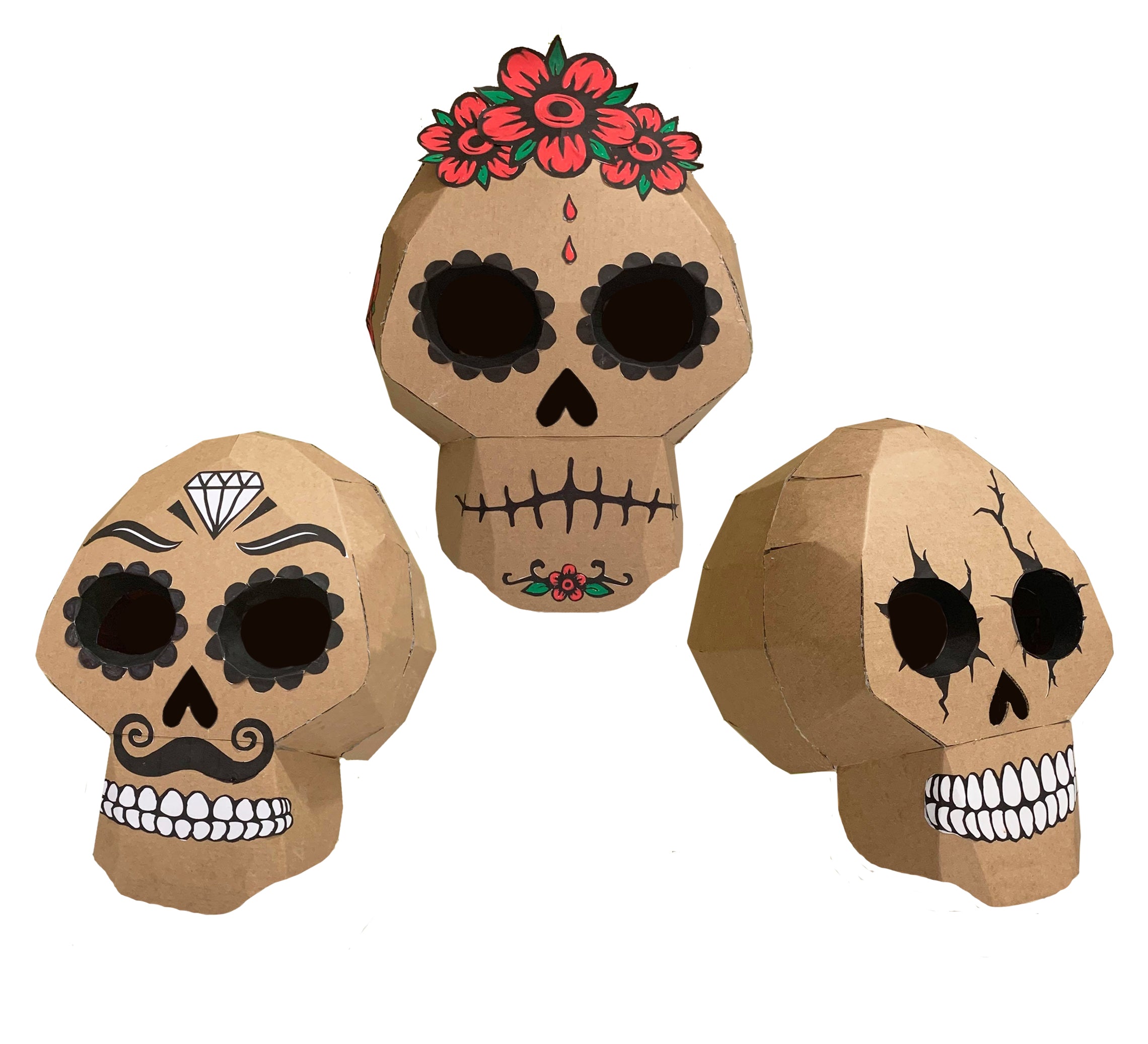 Three cardboard skull decorations with artistic designs on a white background