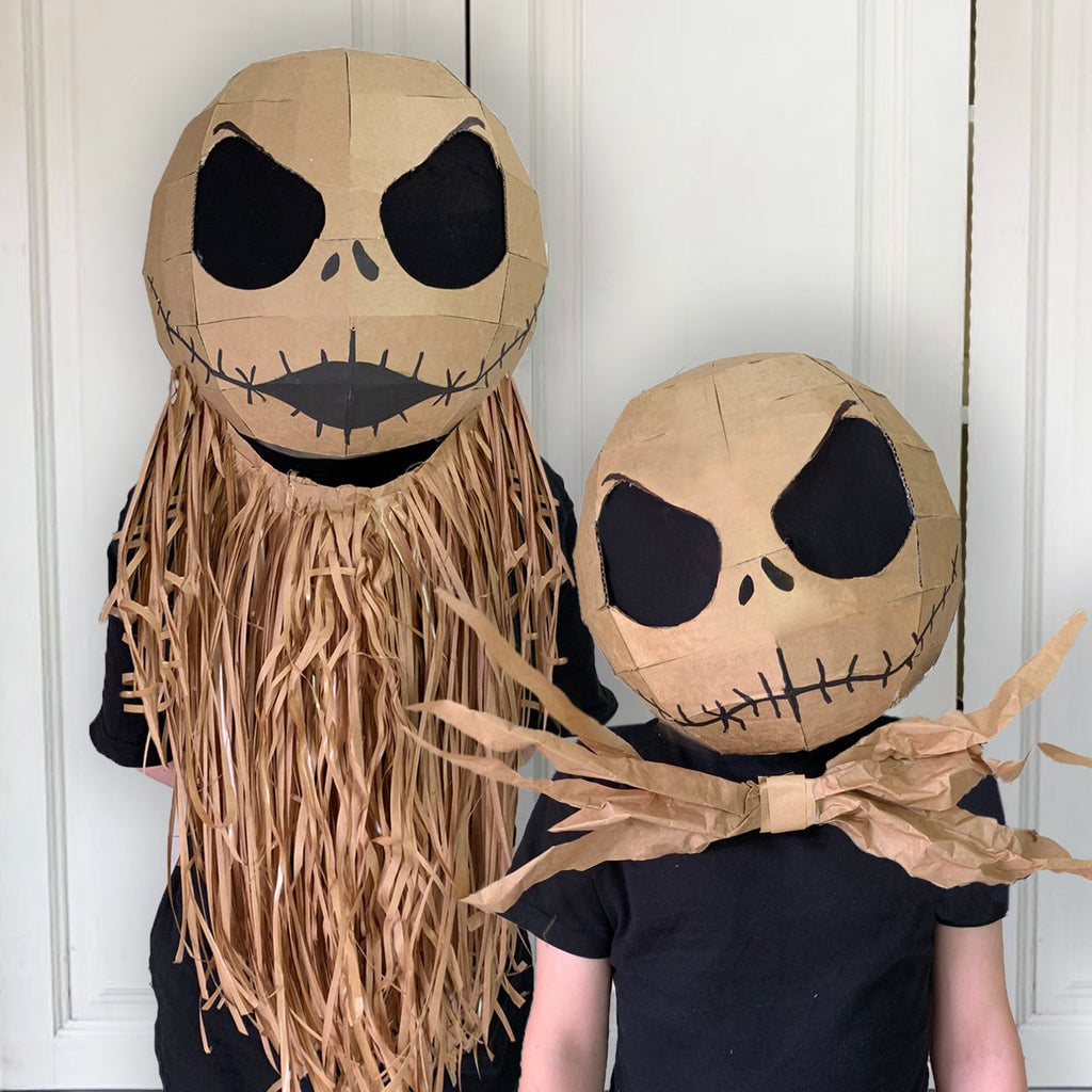 Two Jack skellington inspired costumes made from cardboard.